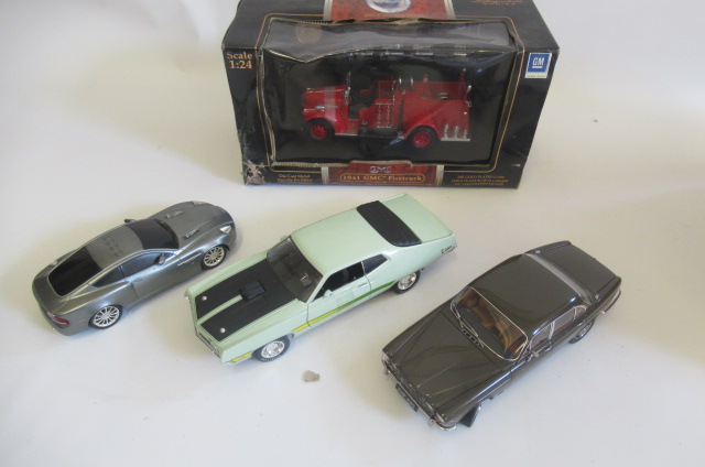 Four large scale vehicles comprising G.M.L. fire truck Image