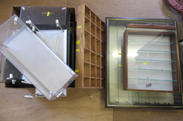 Display cabinet for model cars comprising two wall mounted glass cabinets and plastic display boxes Image