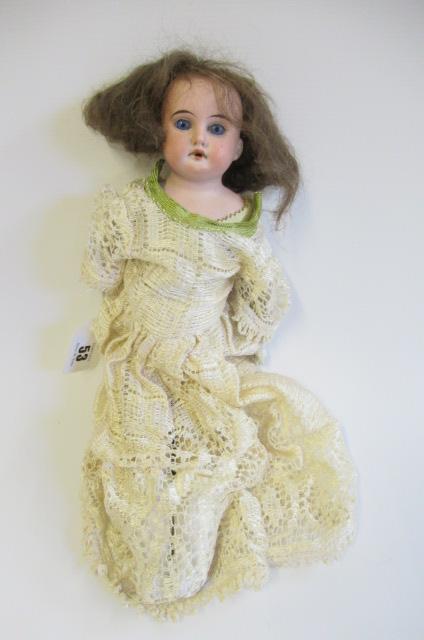 An Armand Marseille bisque shoulder head doll Image