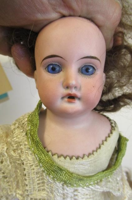 An Armand Marseille bisque shoulder head doll Image
