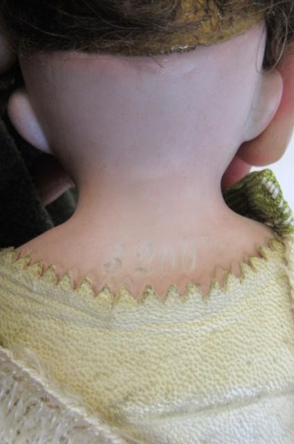 An Armand Marseille bisque shoulder head doll Image