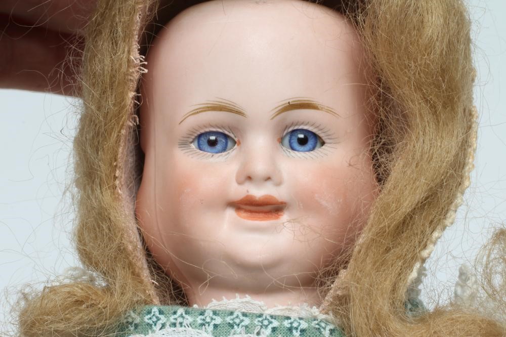 A Carl Bergner three faced bisque head doll Image