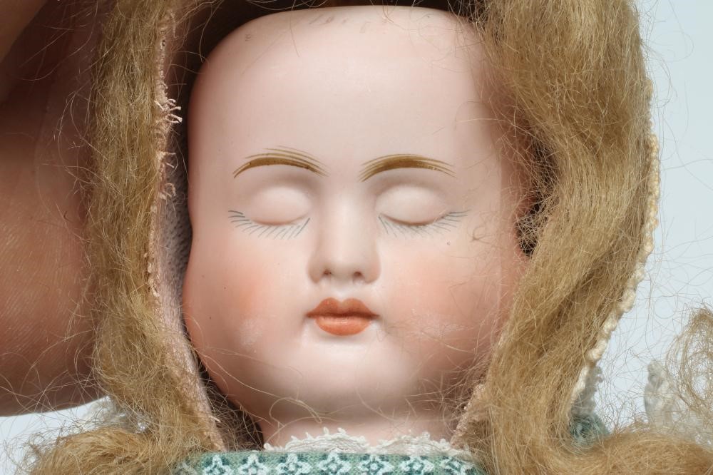 A Carl Bergner three faced bisque head doll Image