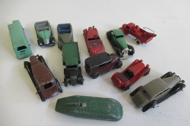 Twelve playworn Dinky vehicles including cars Image