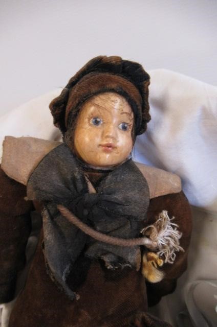 A collection of dolls and soft toys Image