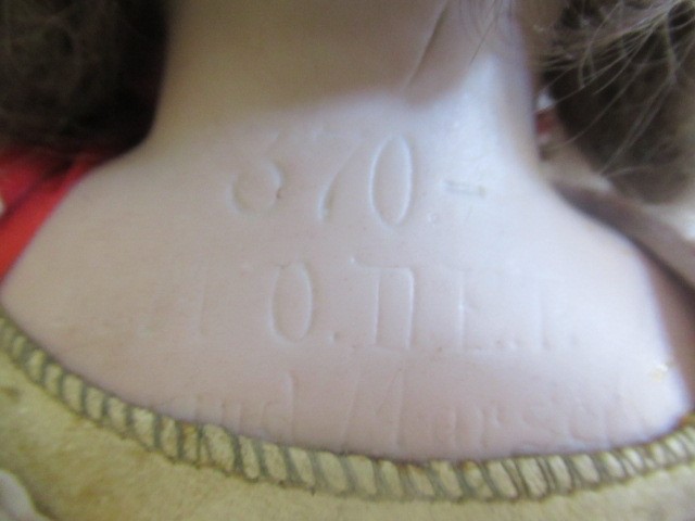 An Armand Marseille bisque shoulder head doll Image