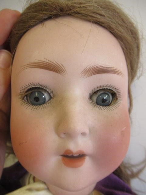 A Simon & Halbig bisque socket head doll Image