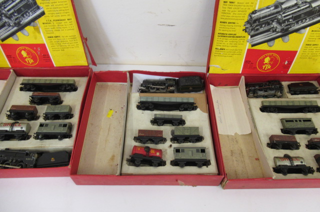 Three playworn Trix Twin train sets comprising three goods sets with tender 0-4-0 Image
