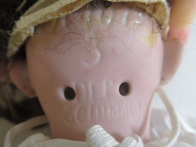 A Simon & Halbig bisque socket head doll Image