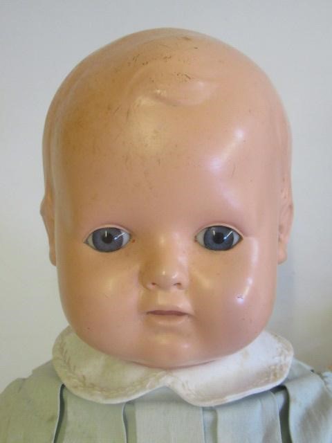 An antique composition shoulder head doll Image