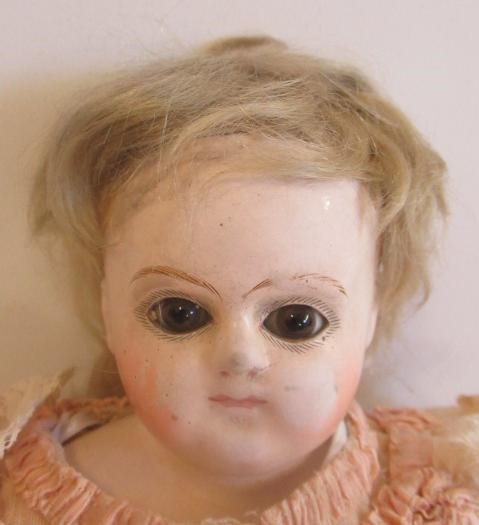 An antique composition shoulder head doll Image