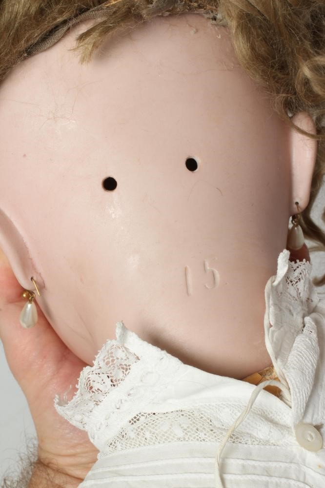 A large German bisque socket head doll Image