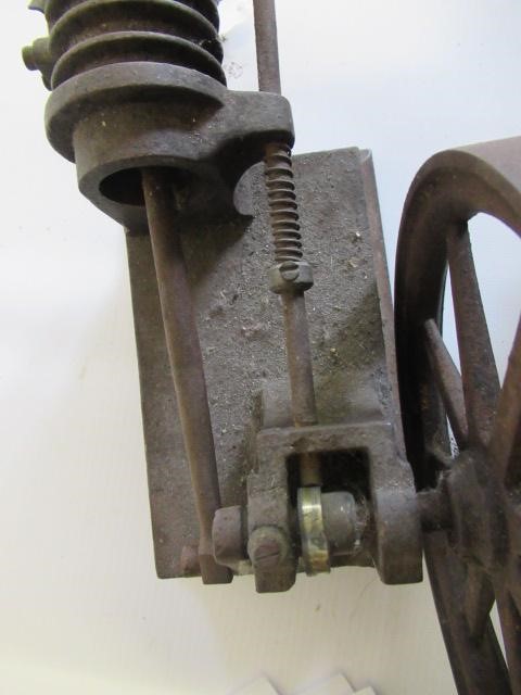 A small hot air engine flywheel and cylinder on cast base Image