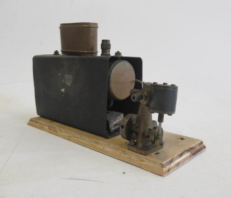 A small oscillating Marine boat engine spirit fired on wood base Image