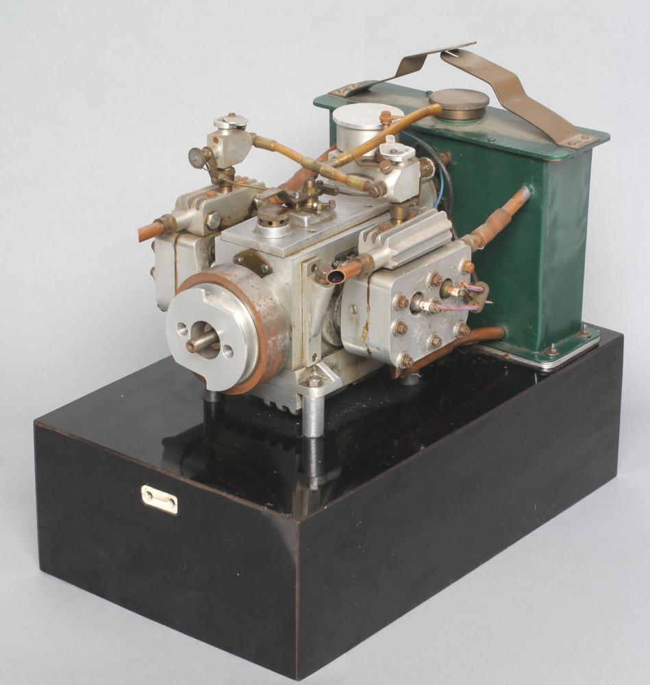 A twin cylinder petrol engine with four spark plugs Image