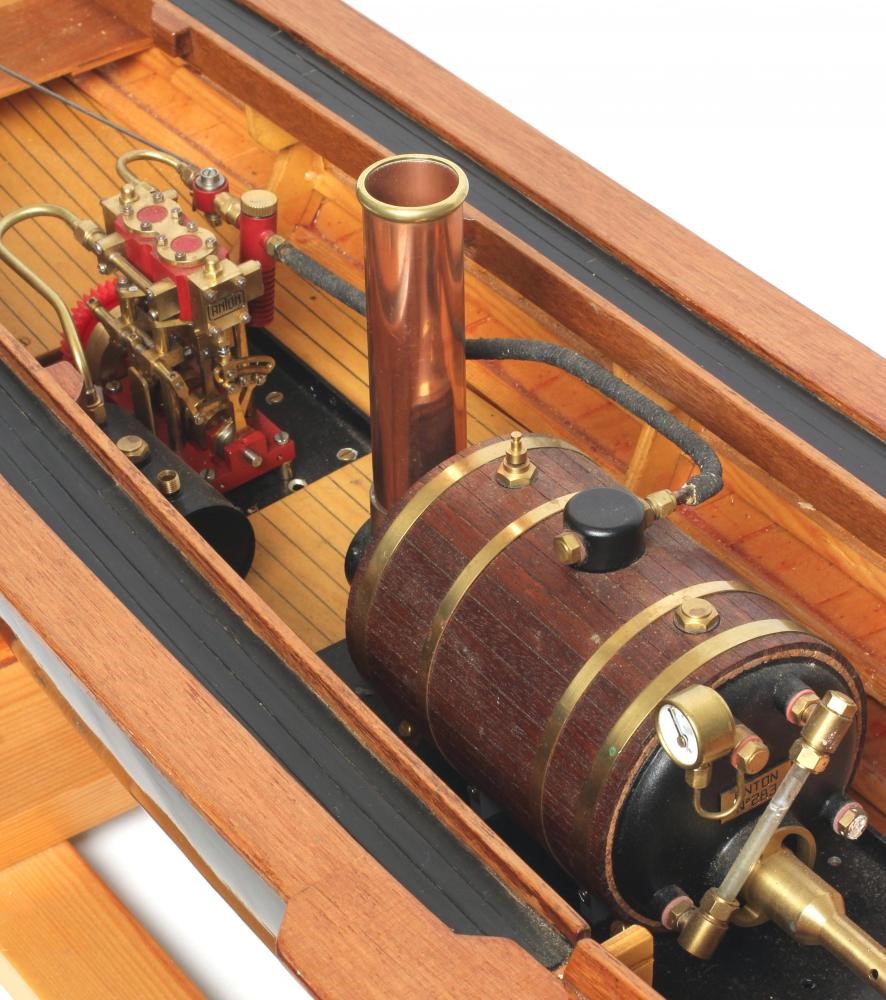 A radio controlled steam launch fitted with twin cylinder reversing steam engine and gas fired Image