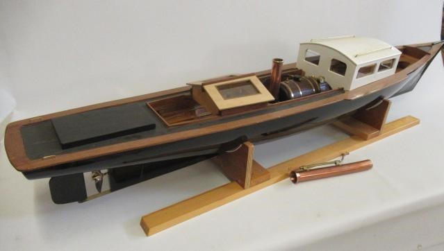 A radio controlled steam launch fitted with twin cylinder reversing steam engine and gas fired Image
