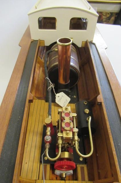 A radio controlled steam launch fitted with twin cylinder reversing steam engine and gas fired Image