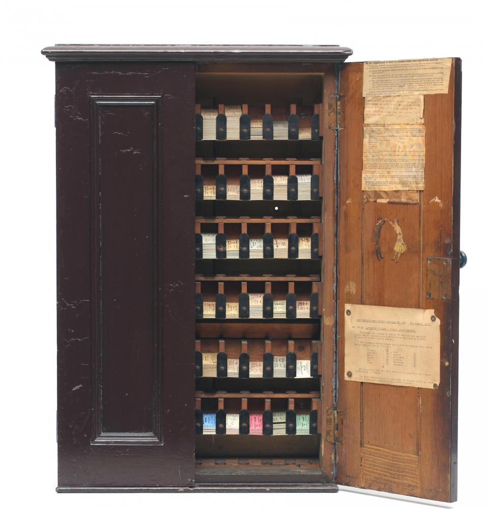 A railway ticket cabinet containing a large number of unused tickets for destination in Ireland Image