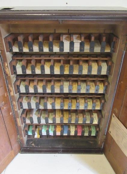 A railway ticket cabinet containing a large number of unused tickets for destination in Ireland Image