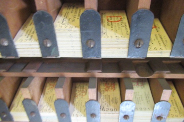 A railway ticket cabinet containing a large number of unused tickets for destination in Ireland Image