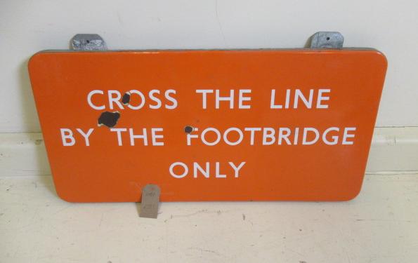 B.R. "N.E." enamel sign "Cross the line by the Footbridge only" finished in orange with white Image