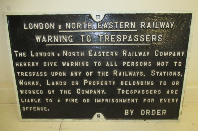 A cast iron London Midland and Scottish Railways Trespass Notice Image