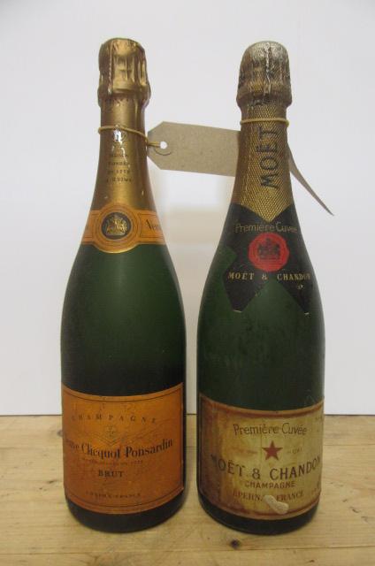 One bottle Moet & Chandon and one bottle Veuve Clicquot Ponsardin (both over 40 years old) (Est. Image