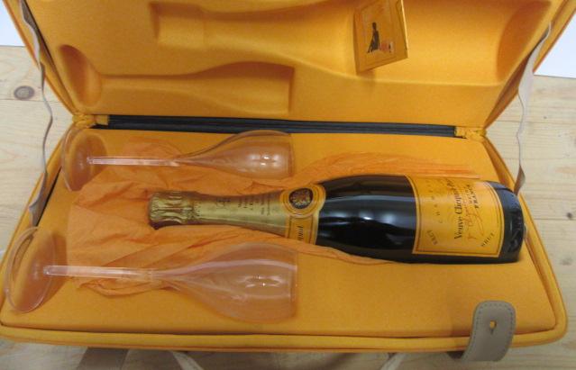 A Veuve Clicquot Traveller's Case containing one bottle NV Veuve Clicquot Ponsardin Brut Champagne Image