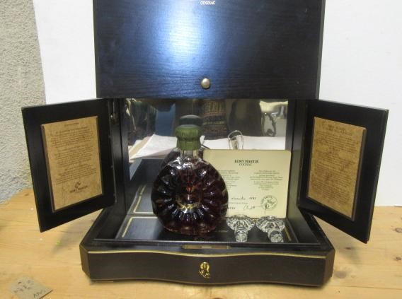 One bottle Remy Martin Cognac in decorated Centaure Baccarat Cristal Decanter and two stoppers Image