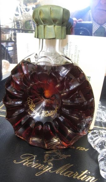 One bottle Remy Martin Cognac in decorated Centaure Baccarat Cristal Decanter and two stoppers Image
