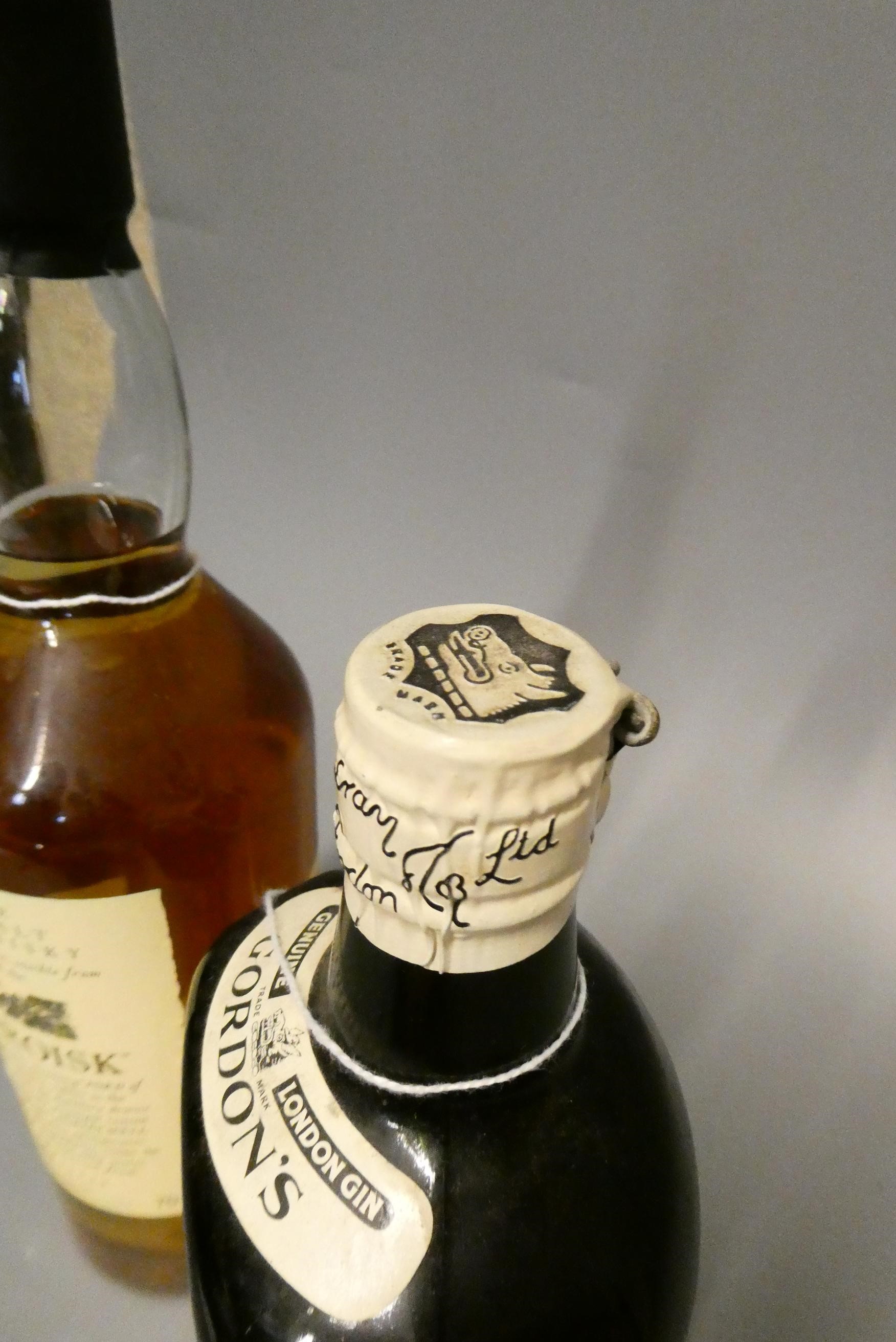 Two bottled spirits, comprising one 70cl Auchroisk 10yr old Speyside single malt whisky, 43%, and a Image