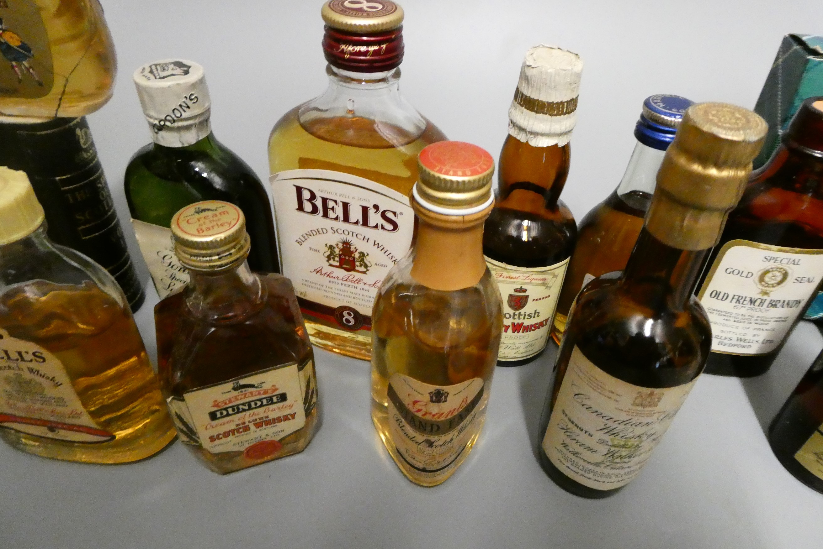 A large quantity of miniatures, including 18 whisky, 4 gin, Martell cognac, sherry and others (Est. Image