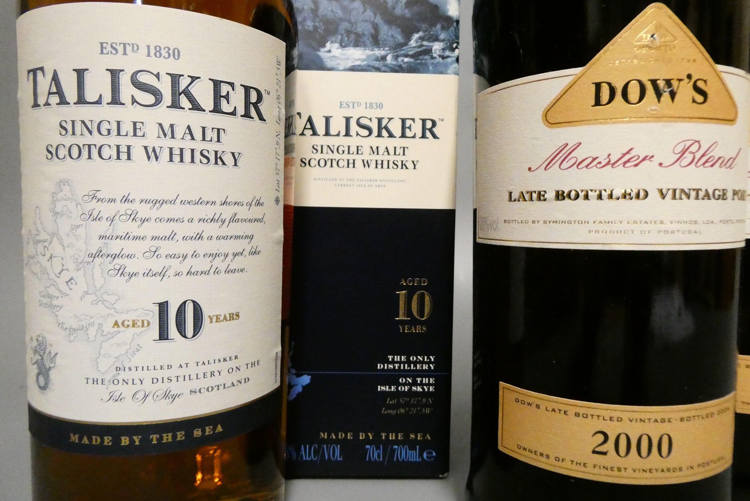 A boxed Talisker 10yr old single malt Scotch whisky, together with two Dow's Master Blend LBV 2000 Image