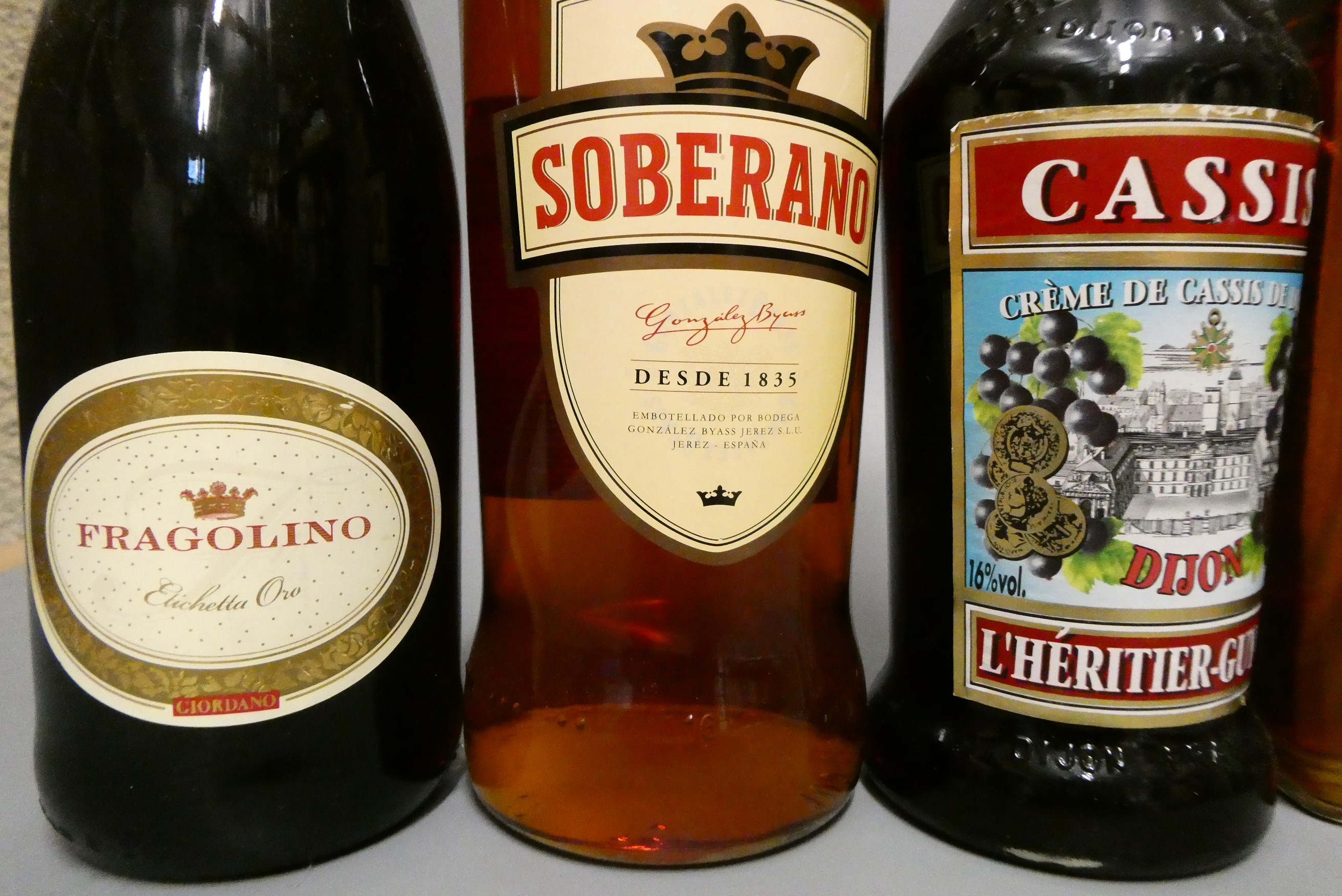 Seven bottles of mixed alcohol Image