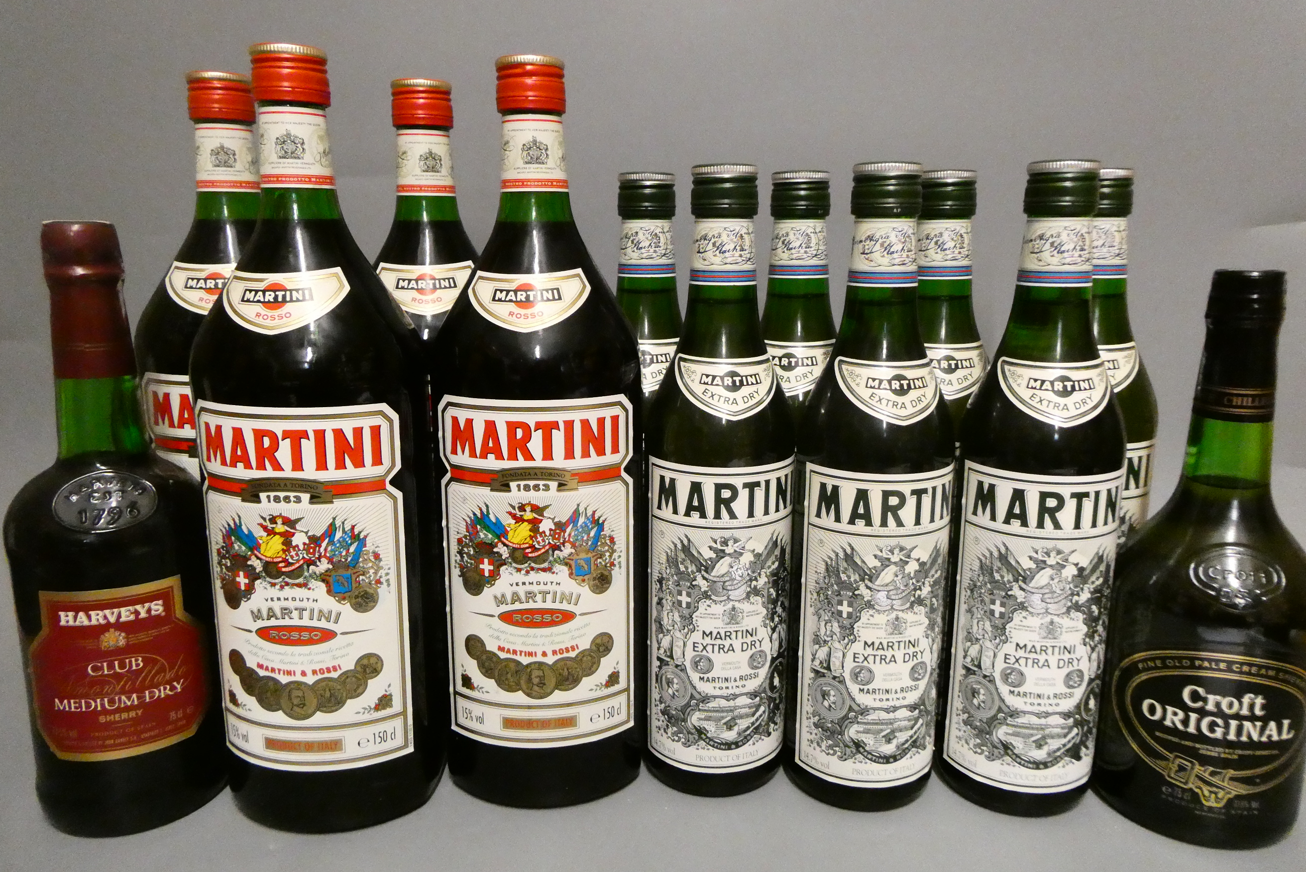 Thirteen bottles comprising four 150cl Martini, seven 75cl Martini Extra Dry, one 75cl Harvey's Image