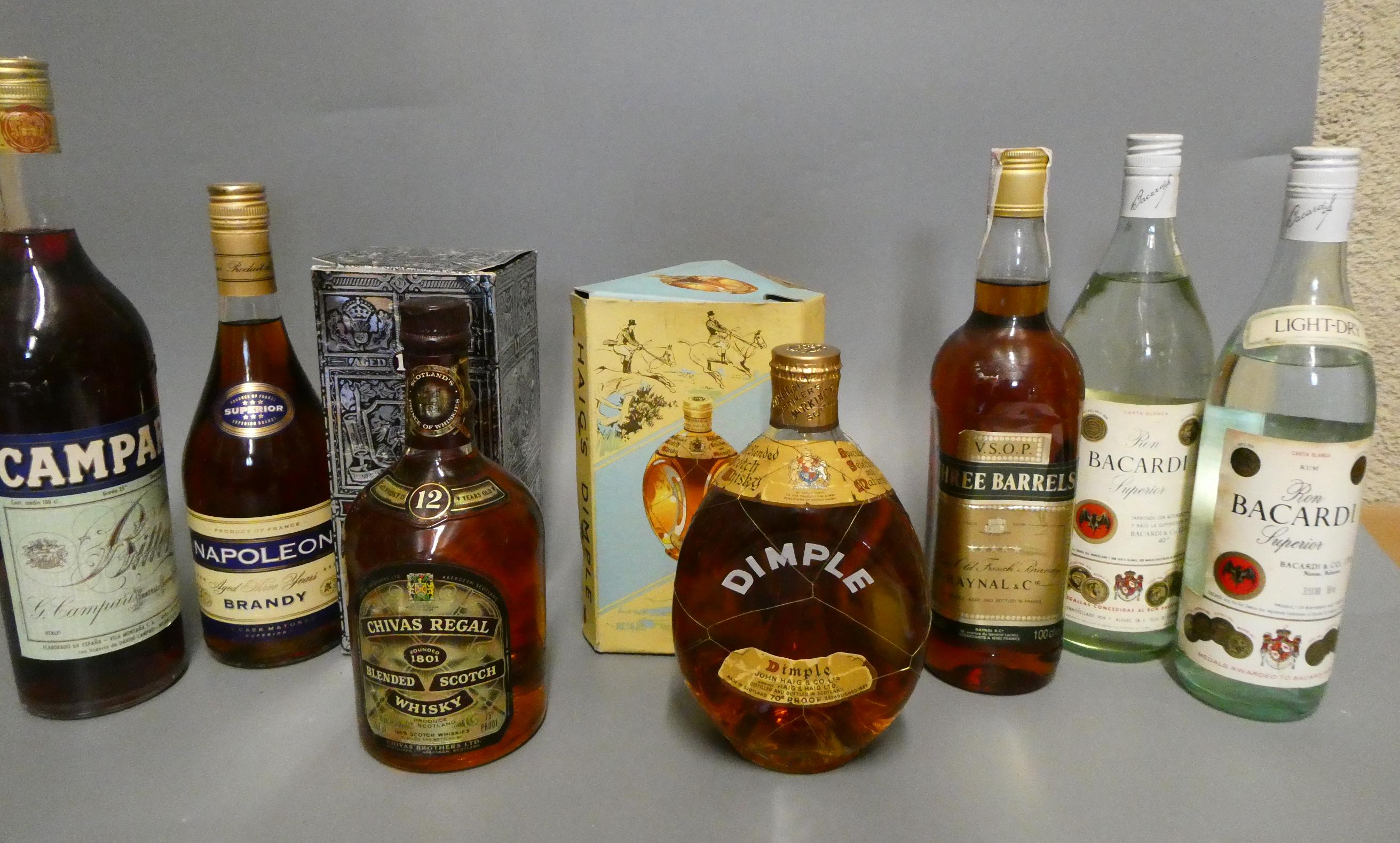 Seven bottles of mixed spirits Image