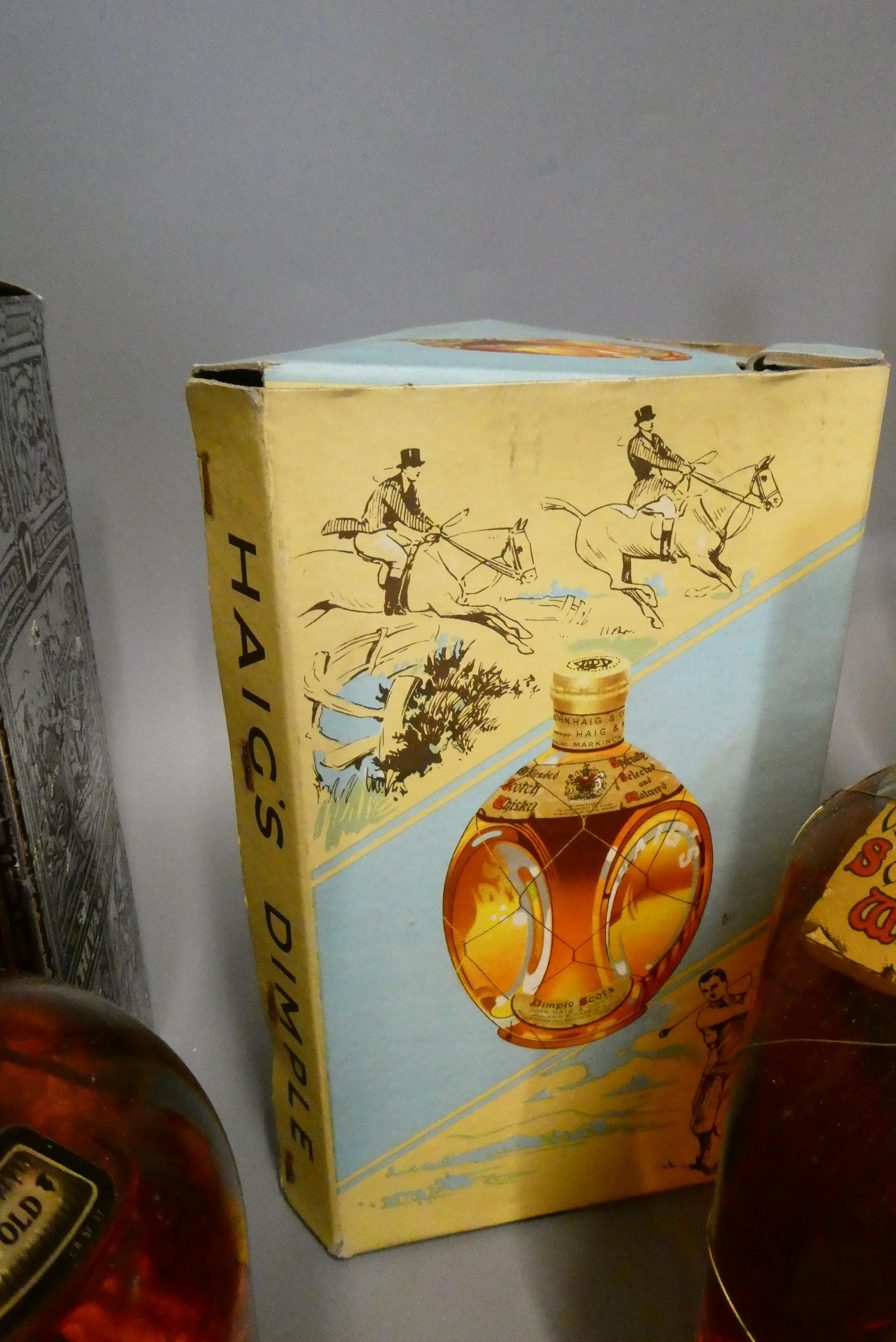 Seven bottles of mixed spirits Image