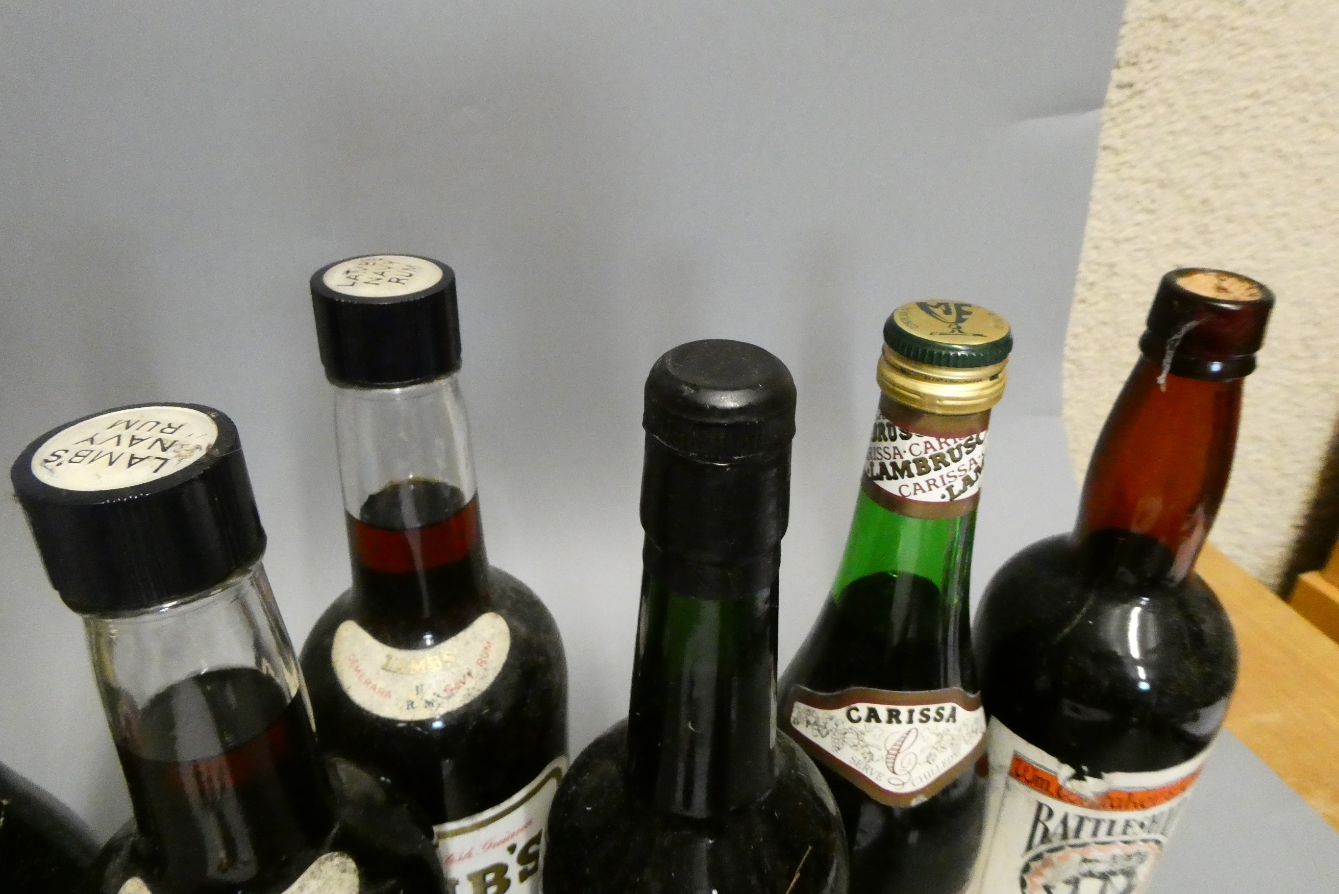 Eleven bottles of mixed alcohol Image