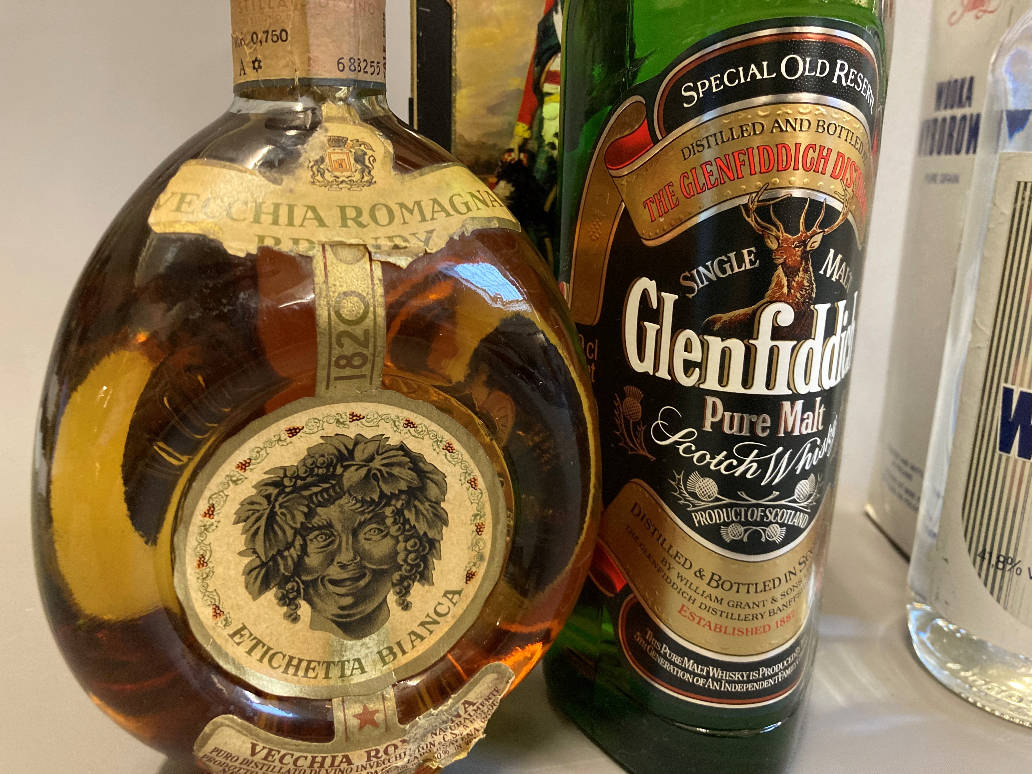 Three bottled spirits, comprising a tinned Gelnfiddich Clan Sinclair pure malt, a vintage Vecchia Image