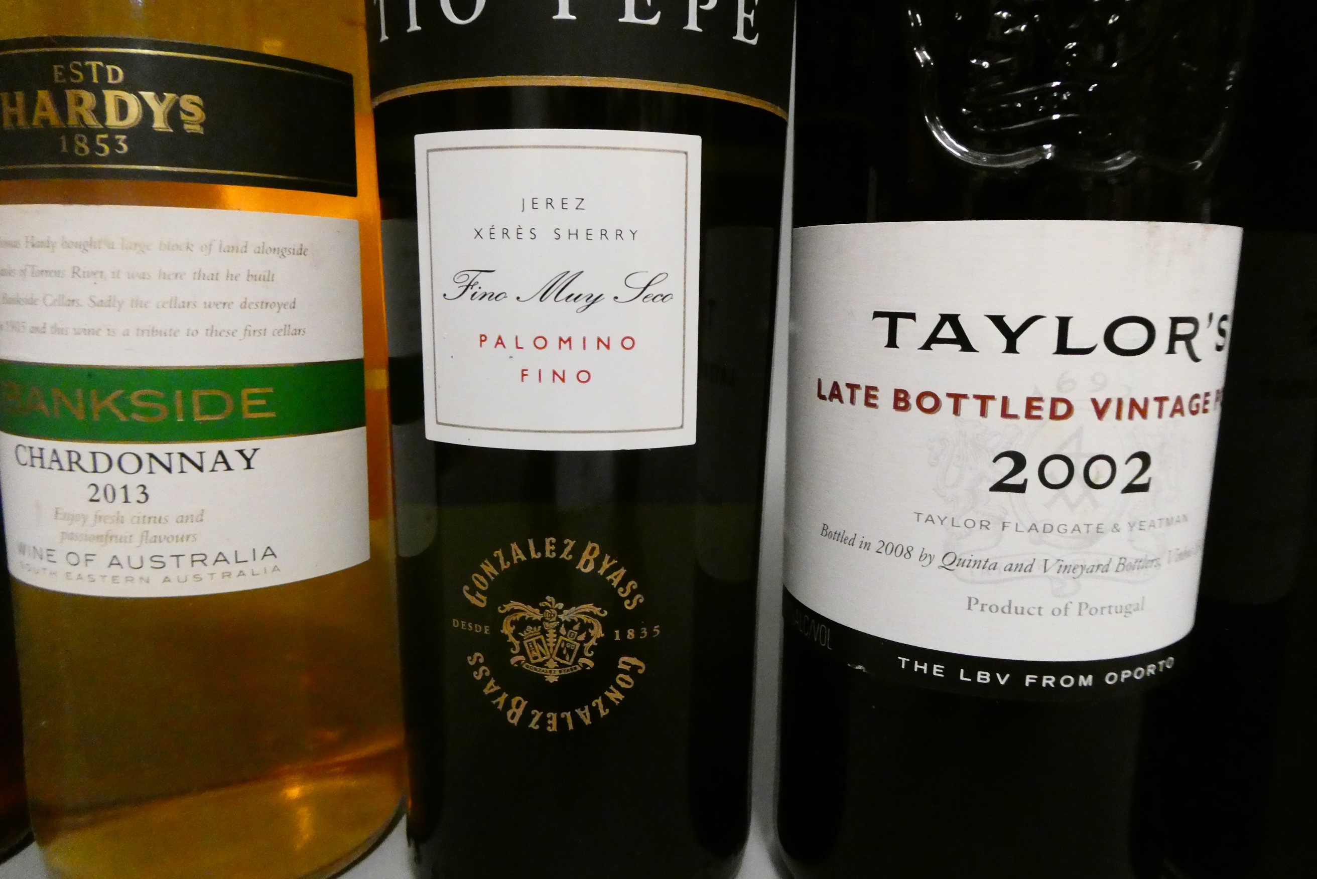 Thirteen bottles & one half bottle of mixed alcohol Image