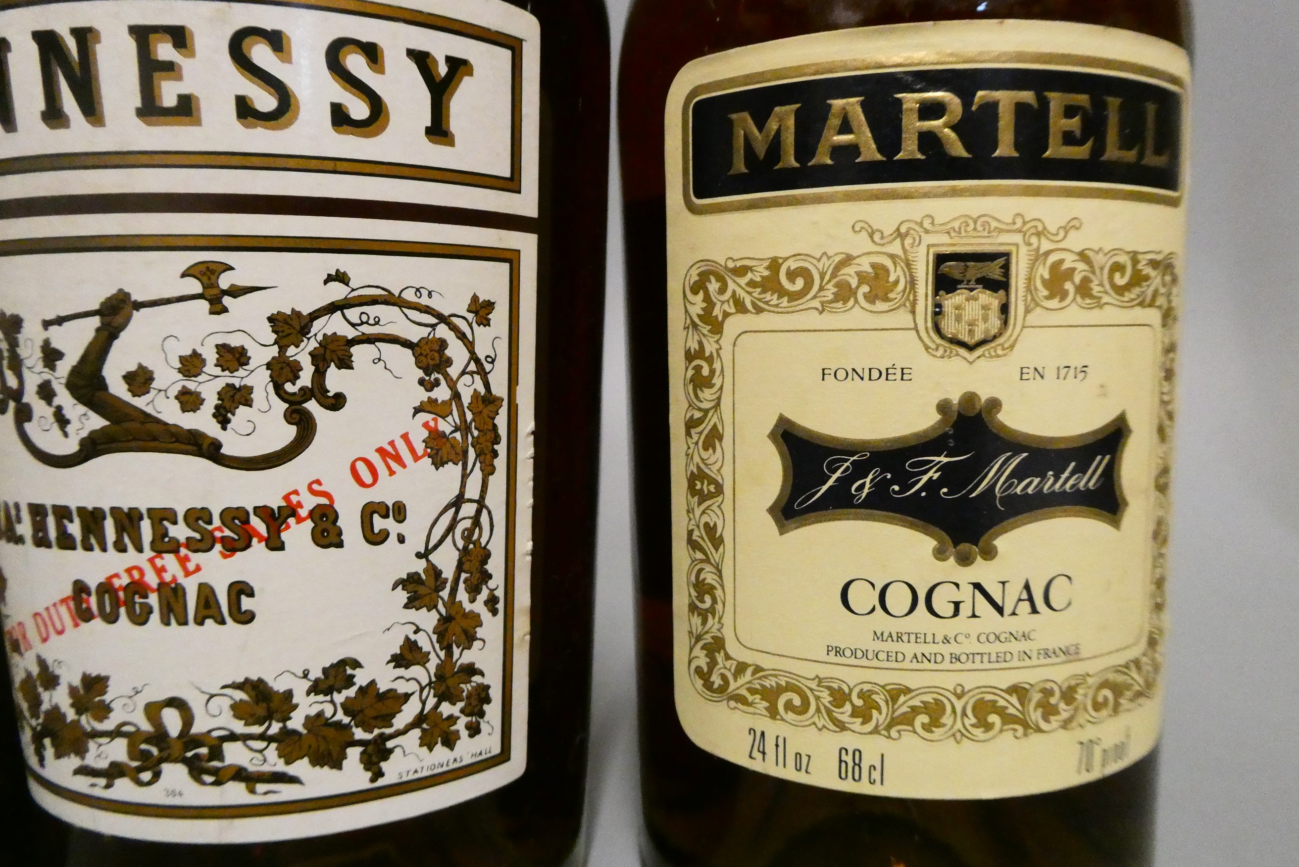 Three bottles of Cognac, comprising a Hennessy Bras Arme, a 68cl Martell VS and a 68.2cl Remy Martin Image