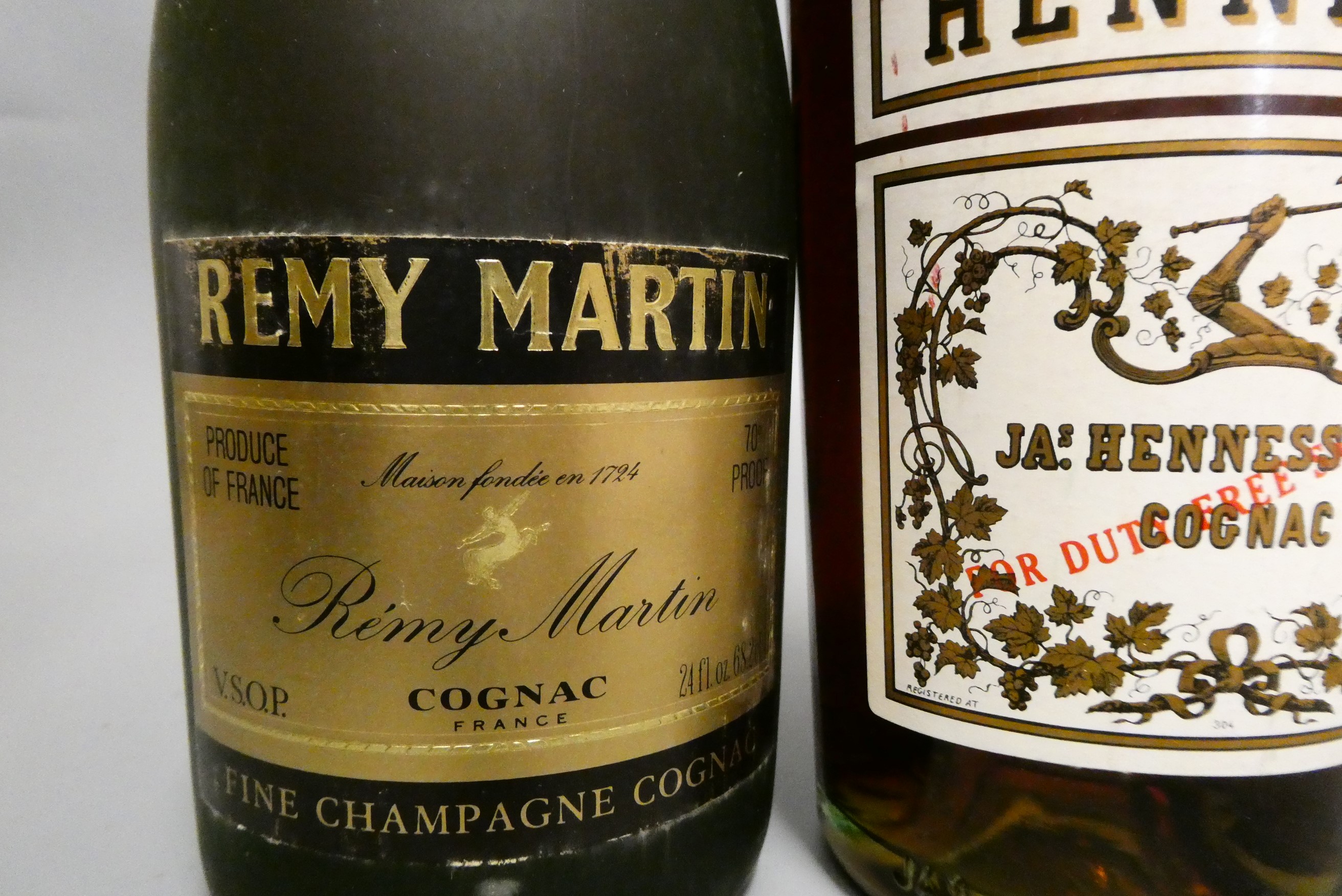 Three bottles of Cognac, comprising a Hennessy Bras Arme, a 68cl Martell VS and a 68.2cl Remy Martin Image