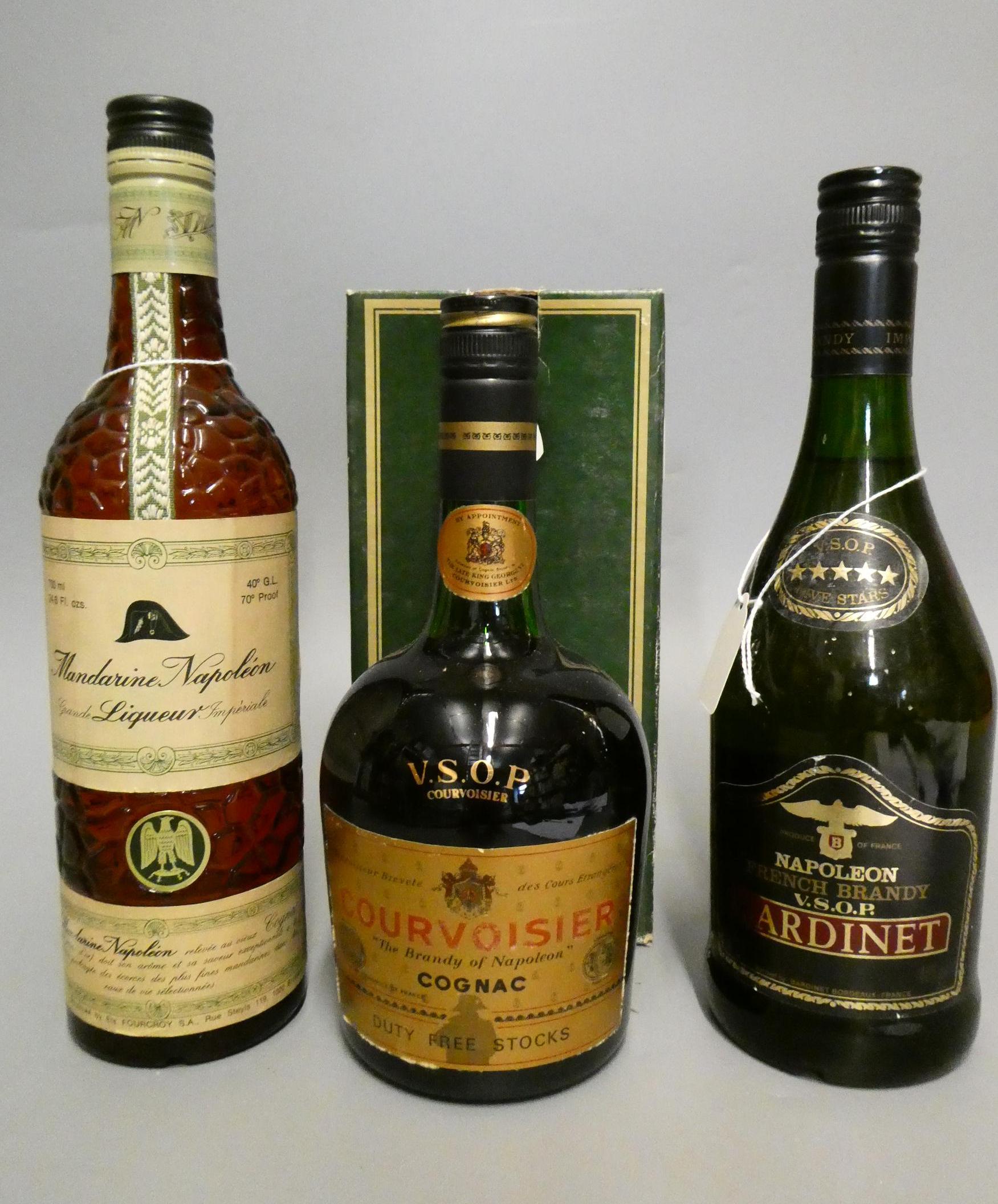 Three bottles, comprising a boxed Courvoisier VSOP cognac, a Bardinet Napoleon VSOP French Brandy, Image