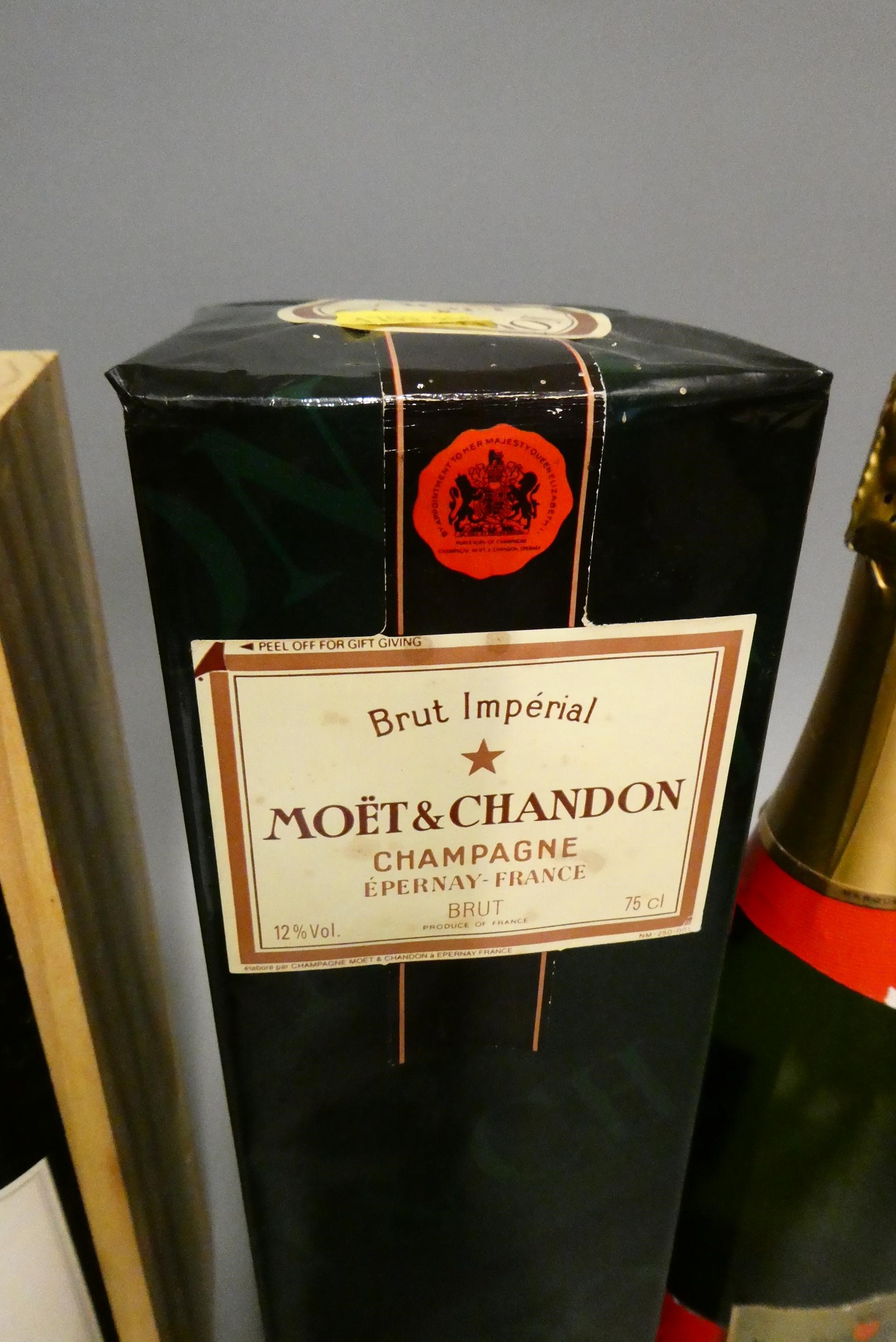 Three mixed bottles, comprising a boxed bottle of Warre's LBV 1994 port, a boxed Moet & Chandon brut Image