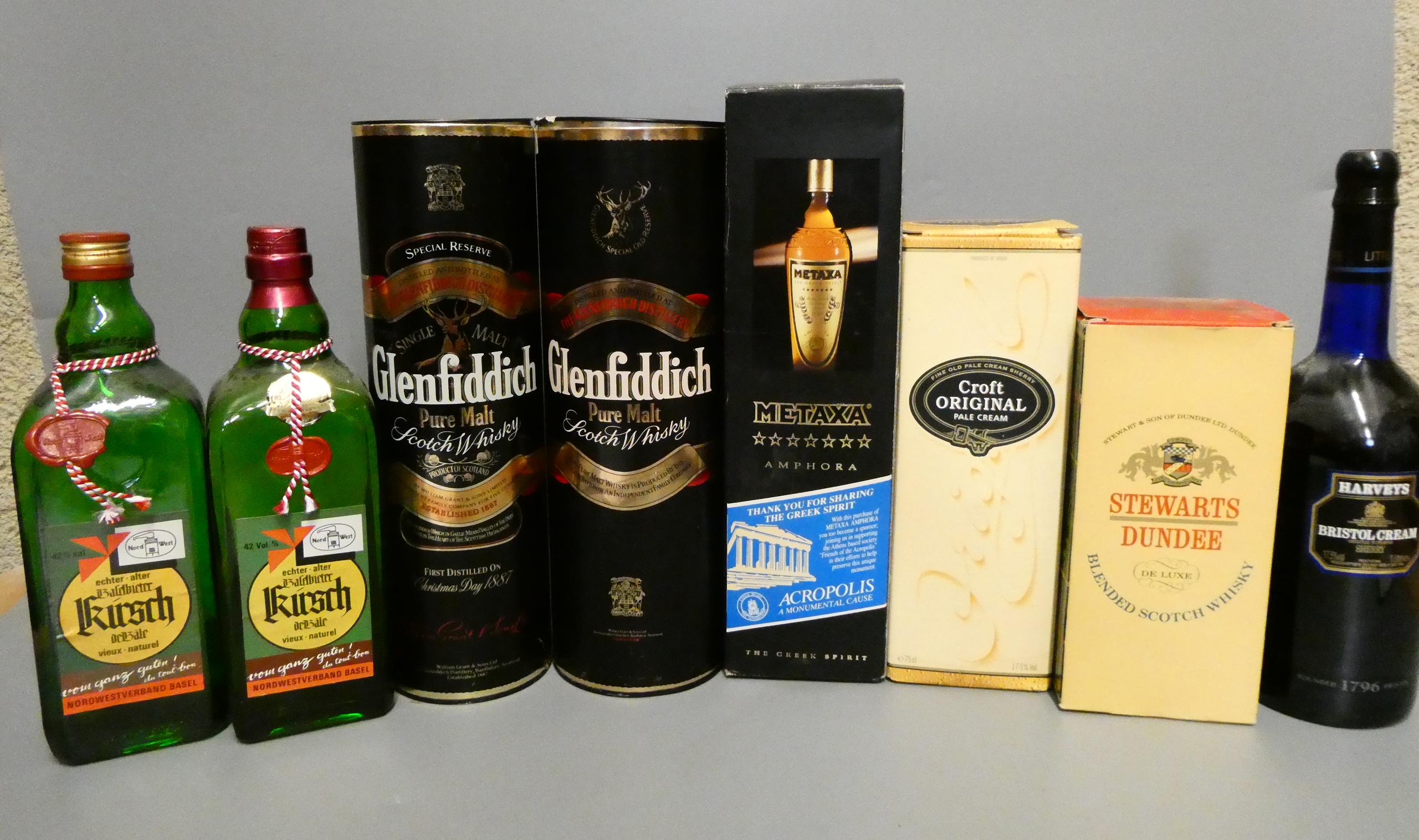 Eight bottles of mixed spirits Image