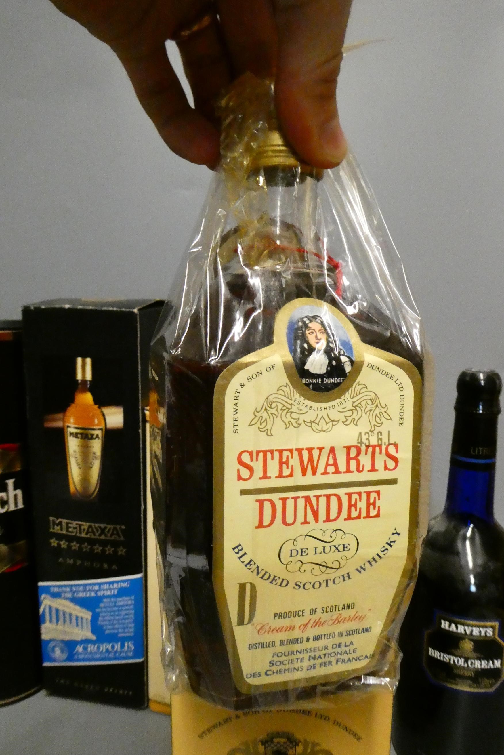 Eight bottles of mixed spirits Image