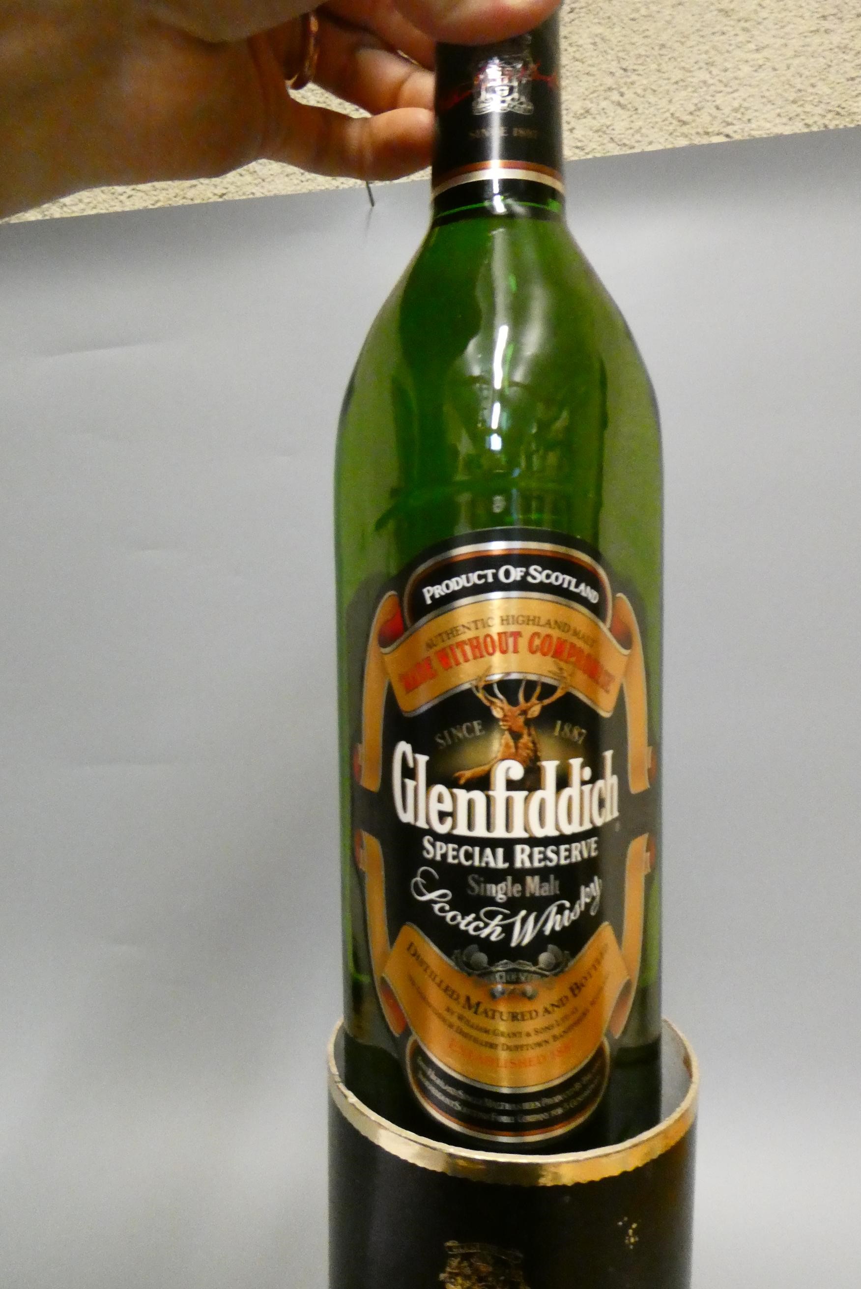 Eight bottles of mixed spirits Image