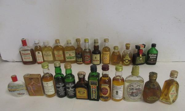 Twenty five miniatures of 70° proof malt and other whisky Image