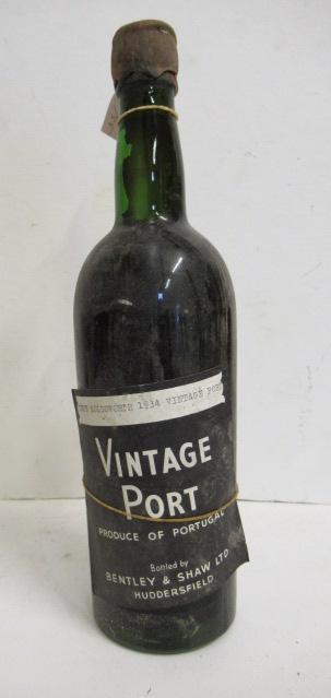One bottle old vintage port accompanied by label printed "Tuke Holdsworth 1934 Vintage Port" Image